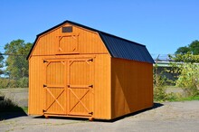 American Style Wooded Shed. A Shed Is Typically Simple, Single-story Roofed Structure In A Back Garden Or On An Allotment That Is Used For Storage, Hobbies, Or As A Workshop. Exterior View