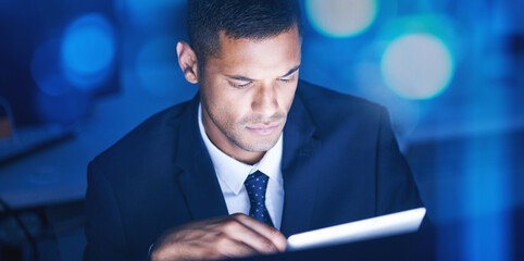 Poster - Businessman with digital tablet overtime for data research in a corporate office at night. Male entrepreneur and executive worker using technology to communicate and network with online app or email