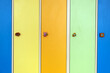 Close up of bright colorful lockers doors with funny animals as door knobs in day care school