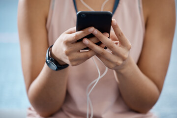 Sticker - Fitness app, phone and communication while typing on phone in sportswear to track progress on smart device with fast network. Close up hands of a woman listening to music or podcast during training