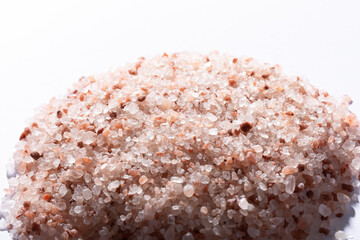 Wall Mural - Close-up of pink himalayan rock salt against white background