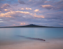 Long Exposure Of Hauraki Gulf And Rangitoto Island From The North Shore At Sunset In Auckland New Zealand