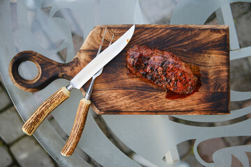 Overhead view of grilled juicy and spicy duck steak