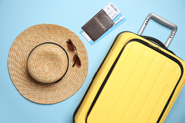 Sticker - Flat lay composition with passport, tickets and travel items on light blue background