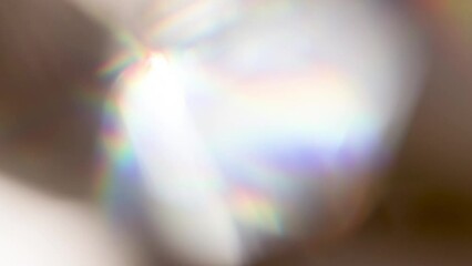 Wall Mural - Rainbow Flicker and Sunny Bokeh. Loop. The light passes through the facets of a slowly rotating diamond and creates repetitive sparkling highlights and rainbow colors