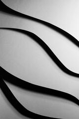 Poster - graphite grey abstract textured geometric relievo stepped background with fly horizontal curved wavy