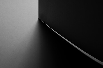 Poster - dark grey carbon textured abstract geometric background with corner of sheets in hard light with thi