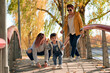 © ADDICTIVE STOCK - Happy LGBT family having fun in park