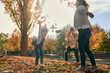 © ADDICTIVE STOCK - Carefree lesbian family with child playing in park