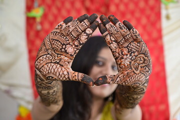 Wall Mural - Hands of Beautiful Indian Bride In Wedding Henna Ceremony. Traditional Indian Ritual. Mehendi Art