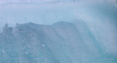 Wall Mural - a close-up of the layered surface of a blue glacier - knud rasmussen glacier near kulusuk - greenlan