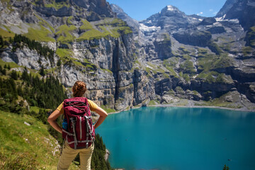 Poster - Tourist in the mountains in Switzerland on Lake Oeschinensee