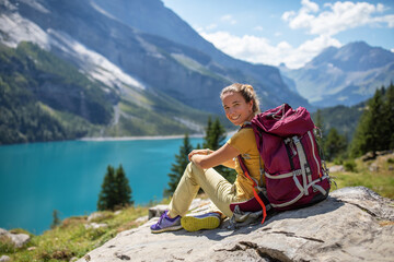 Poster - Tourist in the mountains in Switzerland on Lake Oeschinensee