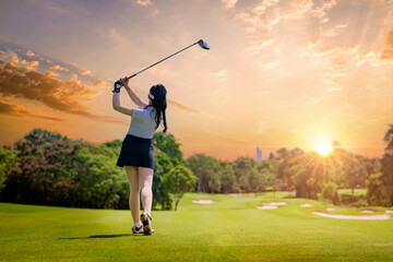 Wall Mural - Professional woman golfer teeing golf in golf tournament competition at golf course for winner	