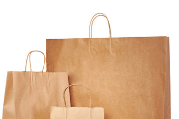 Brown paper bags of different sizes insulated on a white background.