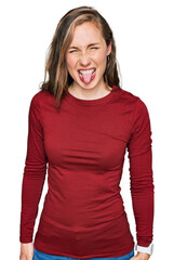 Sticker - Young blonde woman wearing casual clothes sticking tongue out happy with funny expression. emotion concept.