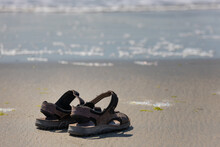 Abandoned Sandals On The Beach