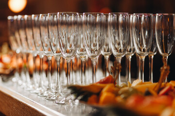 Wall Mural - Empty Champagne glasses on serving tray.