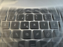 Radial Blurred View On An A Grey Azerty Keyboard Letters