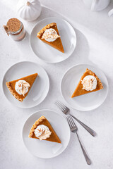 Wall Mural - Slices of traditional pumpkin pie in a light and bright setting