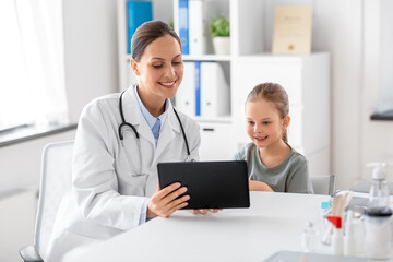 Sticker - medicine, healthcare and pediatry concept - happy smiling female doctor or pediatrician showing tablet computer to little girl patient at clinic