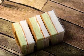 pandan cake on the wooden floor sweet, soft, delicious food background with high resolution