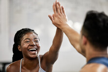 High five, fitness and gym goals success as friends do a team building exercise after training, workout and winning together. Smile, excited and happy girl or woman in celebration with her coach