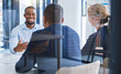 © Azeemud-Deen Jacobs/peopleimages.com - Business people talking in interview with employee, meeting for corporate partnership and happy with collaboration deal in work office. Team of professional staff in discussion about strategy