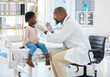 © Nina L/peopleimages.com - Doctor, mouth of child and black man helping little girl in checkup or consultation at a hospital. Medical male expert or pediatrician examining kid for throat infection, illness or sore in clinic.