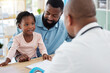© Nina L/peopleimages.com - Doctor consulting with black family, baby and father in doctors office in hospital. Medicine wellness, healthy child development and consultation in nurse, healthcare and medical clinic with smile