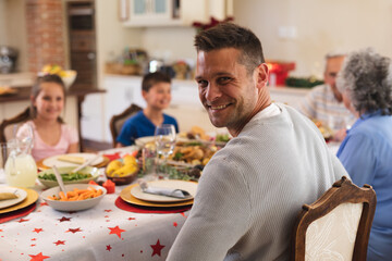 Portrait of caucasian man sitting at table for dinner