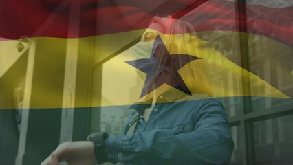 Poster - Animation of flag of ghana waving over caucasian woman wearing face mask in city street