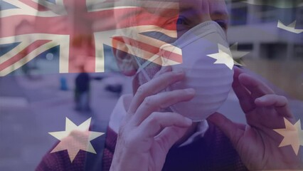 Poster - Animation of flag of australia waving over caucasian man wearing face mask in city street