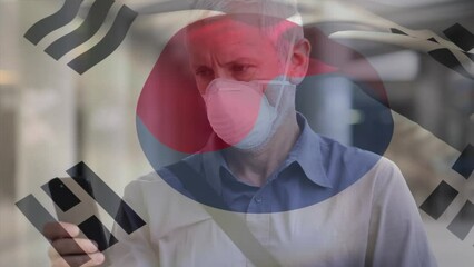 Poster - Animation of flag of south korea waving over caucasian man wearing face mask in city street