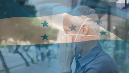 Poster - Animation of flag of honduras waving over caucasian man wearing face mask in city street