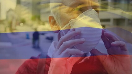 Poster - Animation of flag of cameroon waving over caucasian man wearing face mask in city street