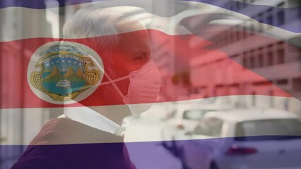 Poster - Animation of flag of costa rica waving over caucasian man wearing face mask in city street