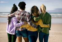 Group Of Diverse Female Embracing And Standing On The Beach