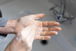 © Wavebreak Media - Close up mid section of a Caucasian woman washing her hands during coronavirus Covid19 pandemic