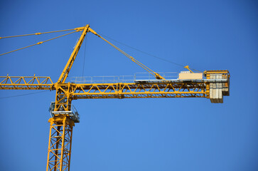 Wall Mural - Asian labor people and thai labour workers use machine and heavy machinery working builder new structure tower high-rise building on scaffold at construction site at capital city in Bangkok, Thailand