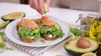 Wall Mural - healthy breakfast or snack - making soft cheese, avocado and salmon sandwich