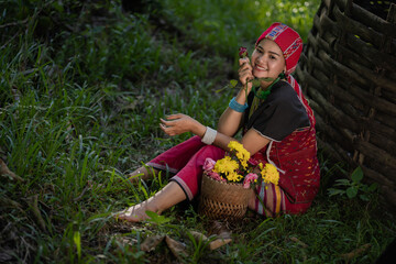 Wall Mural - Beautiful Asian young tribal lady in the native traditional dress culture of Karen people minority ethnic culture. Portraits of identity dress folk applying fashion concepts.