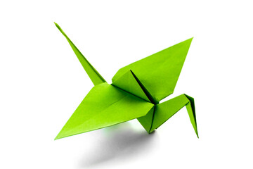 green paper crane origami isolated on a white background