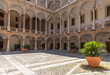 Palermo, Italy - July 6, 2020: Courtyard of Palazzo dei Normanni (Palace of the Normans, Palazzo Reale) in Palermo city. Royal Palace was the seat of the Kings of Sicily during the Norman domination