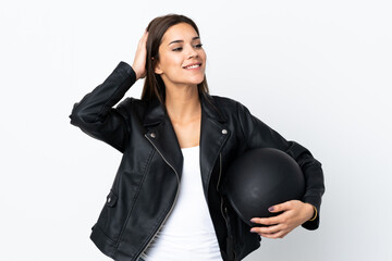 Wall Mural - Caucasian girl holding a motorcycle helmet on white background laughing