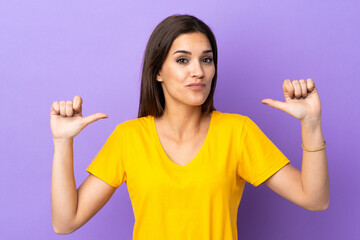 Wall Mural - Young caucasian woman over isolated background proud and self-satisfied