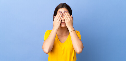 Sticker - Young caucasian woman over isolated background covering eyes by hands