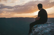 © Бислан Закариев - silhouette of person sitting on rock