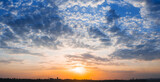 Fototapeta Las - dramatic sunset over the city silhouette