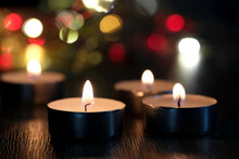 Candle Light And Bokeh Background In The Darkness With Space For Text Or Image.
